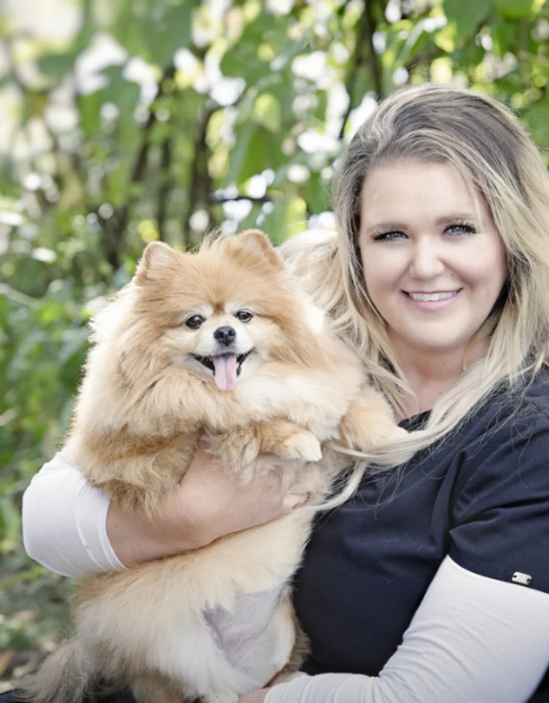 Brittney holding a gold and white fluffy Chihuahua Brittney holding a gold and white fluffy Chihuahua