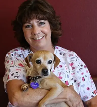 Nine smiling while holding a dog Nine smiling while holding a dog