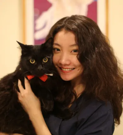 Rita holding black cat