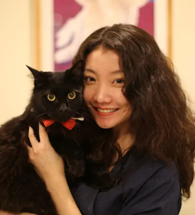 Rita holding black cat Rita holding black cat