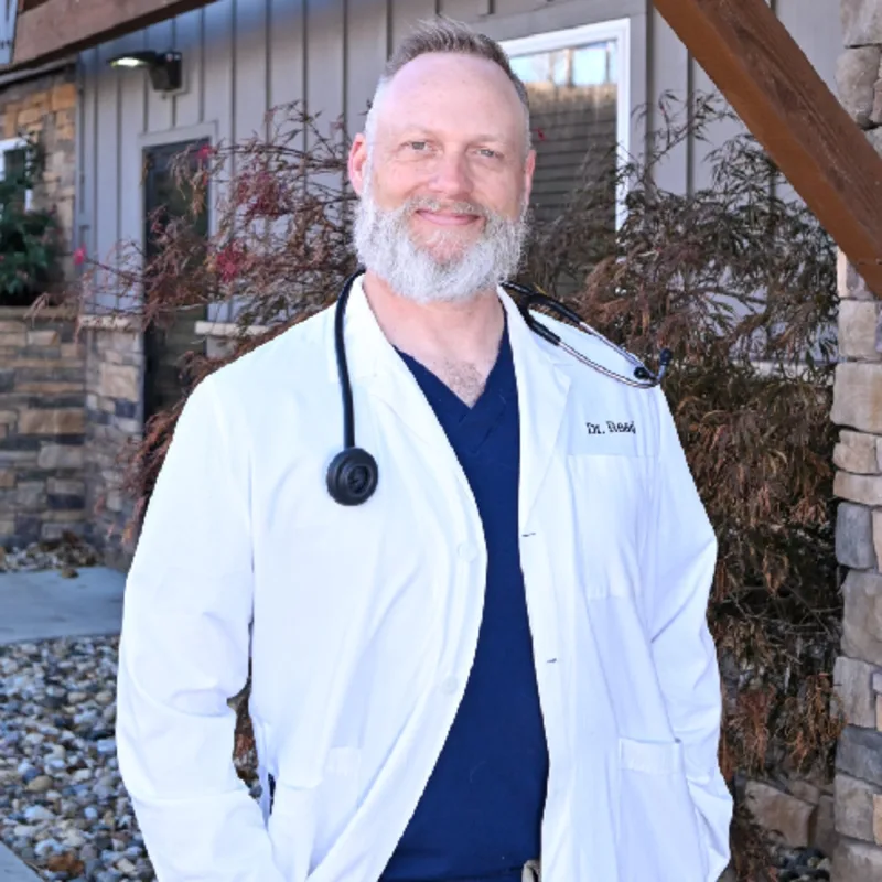 A veterinarian posing for a photo A veterinarian posing for a photo