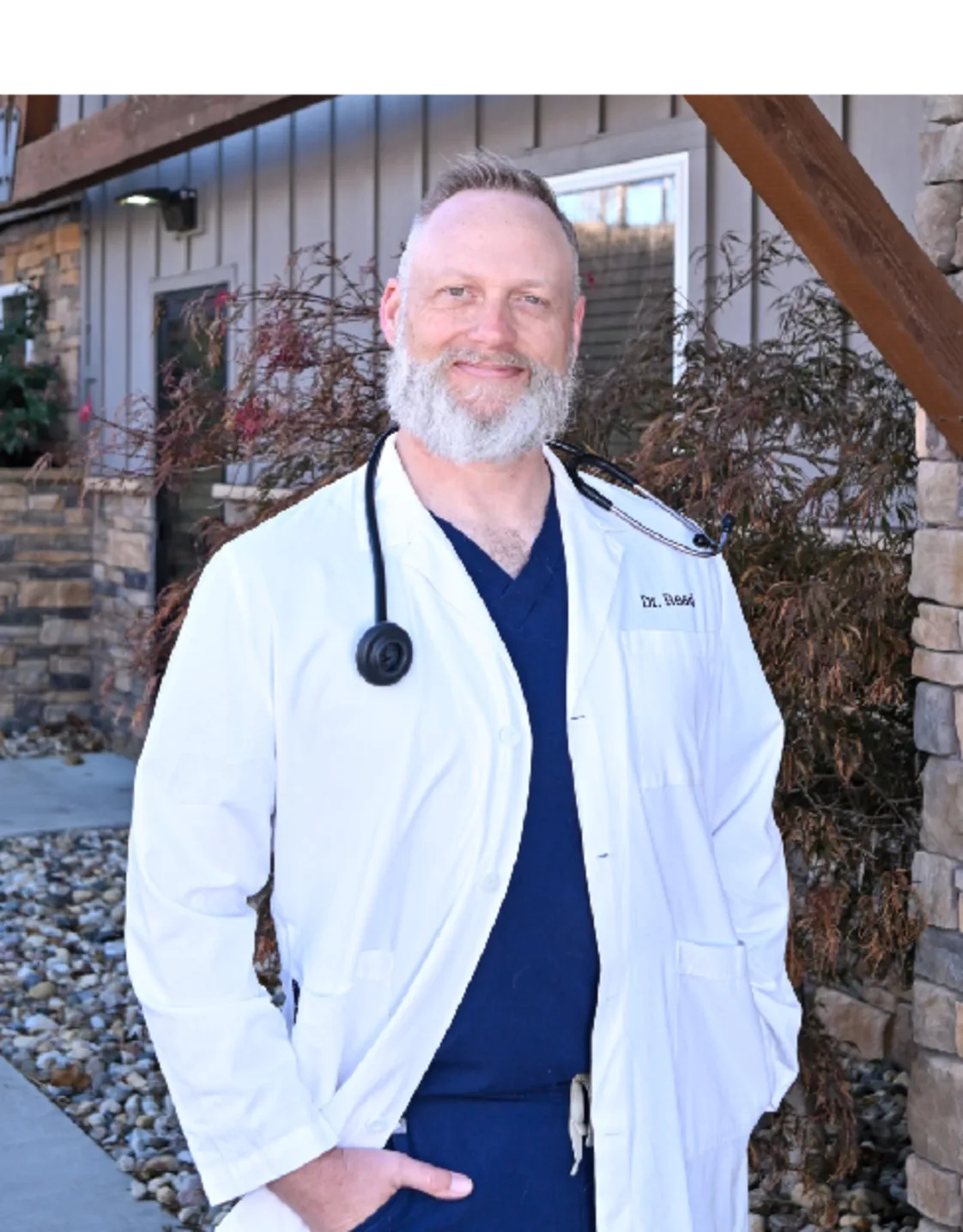 A veterinarian posing for a photo A veterinarian posing for a photo
