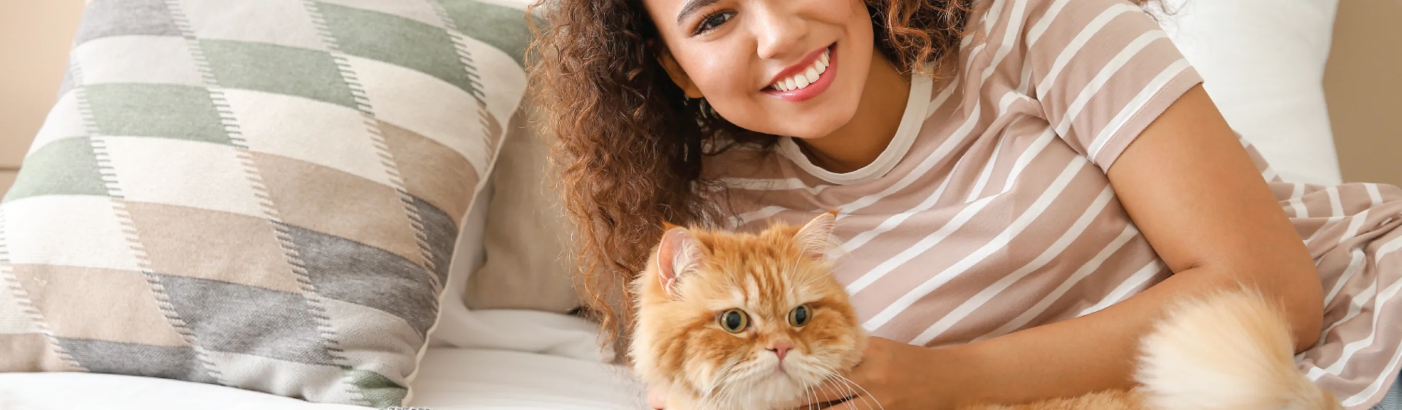 Cat on bed with woman Cat on bed with woman