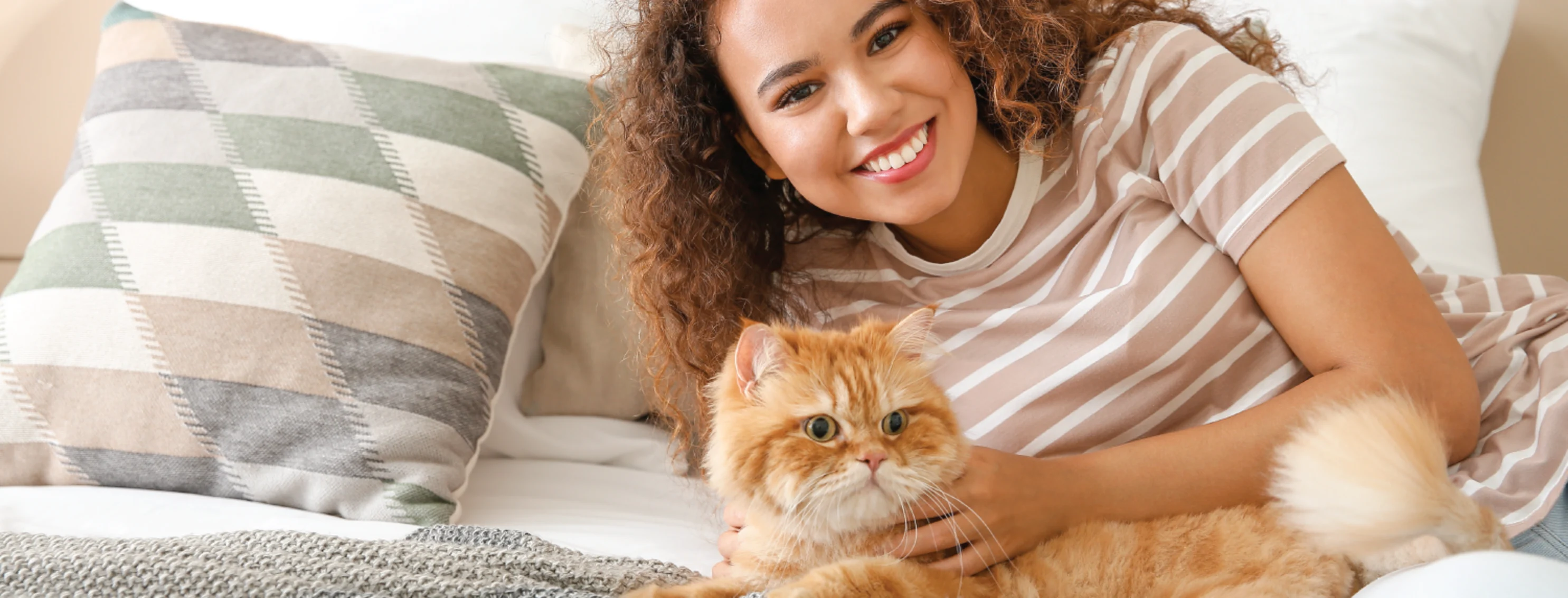 Cat on bed with woman Cat on bed with woman