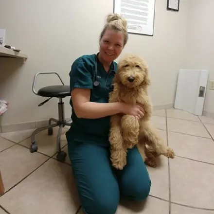 Tiara Veterinary Technician with gold dog