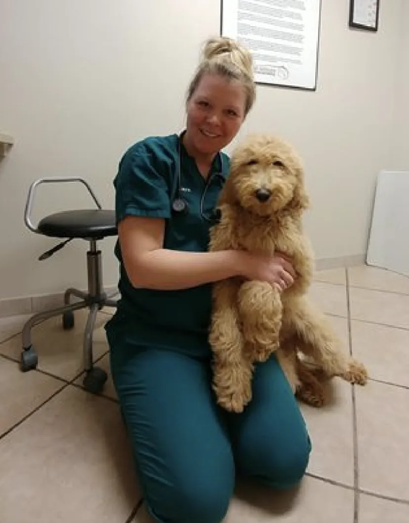 Tiara Veterinary Technician with gold dog
