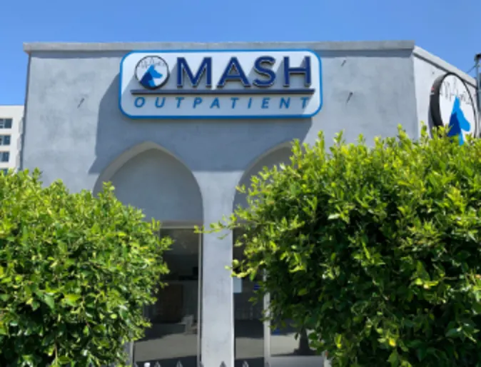 An image of the exterior of MASH at night
