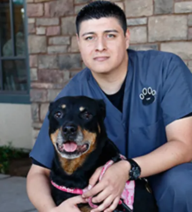 Vet Tech Tony with black dog Vet Tech Tony with black dog