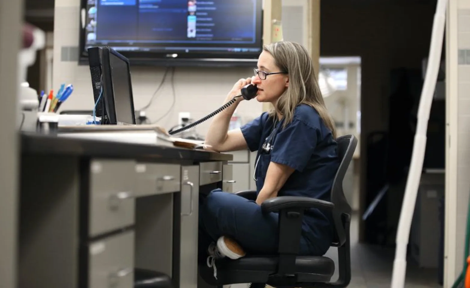 Photo of Doctor on the Phone at Oakhurst Veterinary Hospital Desk Photo of Doctor on the Phone at Oakhurst Veterinary Hospital Desk