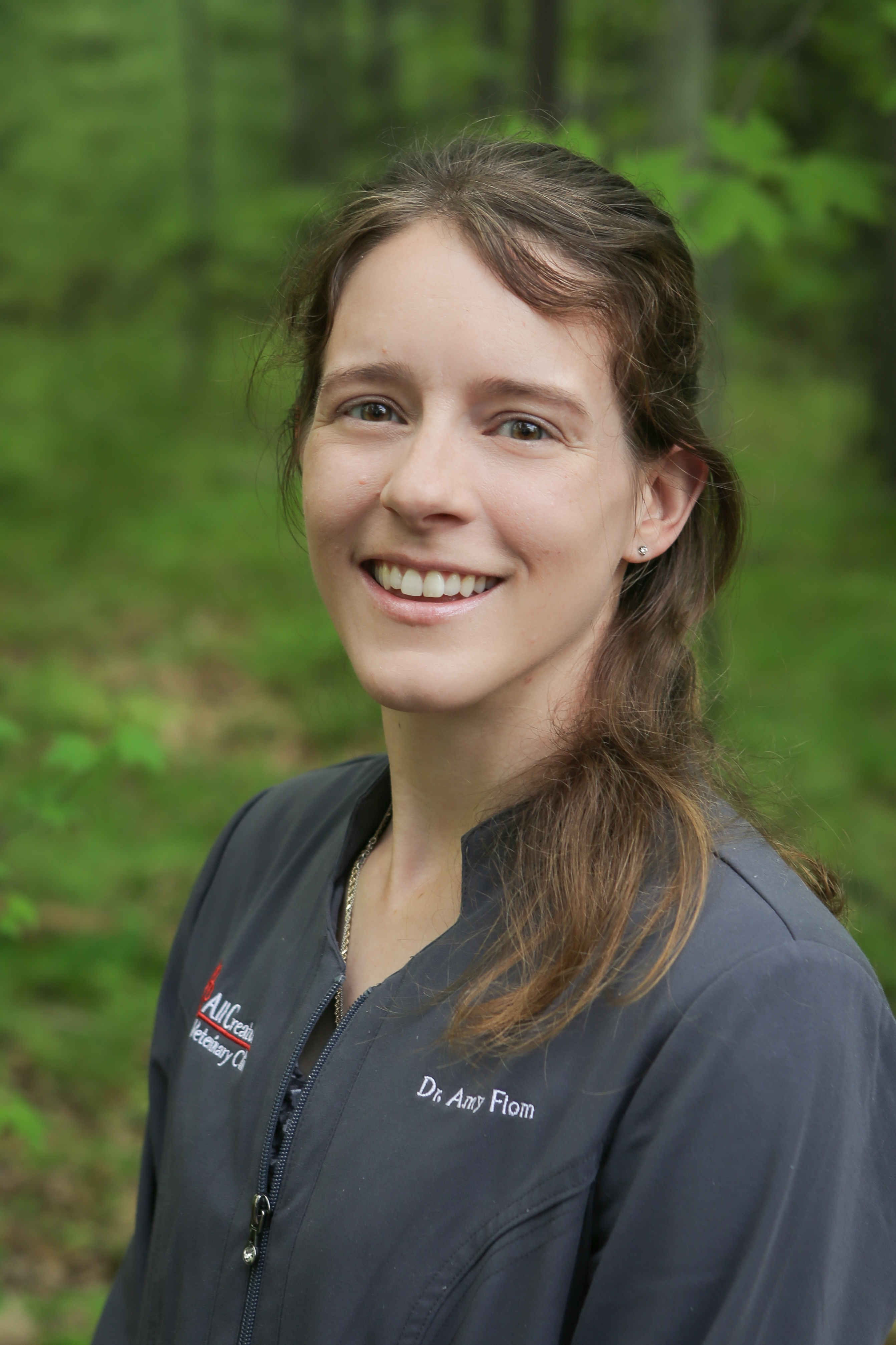 Dr. Amy Flom smiling standing outside