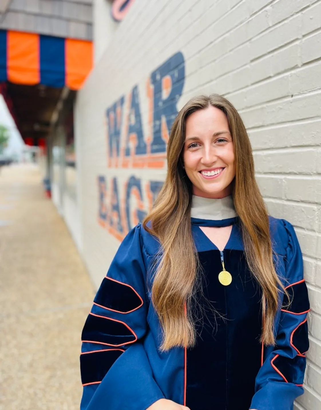 Dr. Kerrigan Steinsultz smiling in a hallway. Dr. Kerrigan Steinsultz smiling in a hallway.