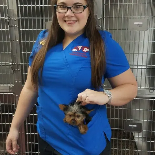 The Animalife Veterinary Center staff with dog in pocket