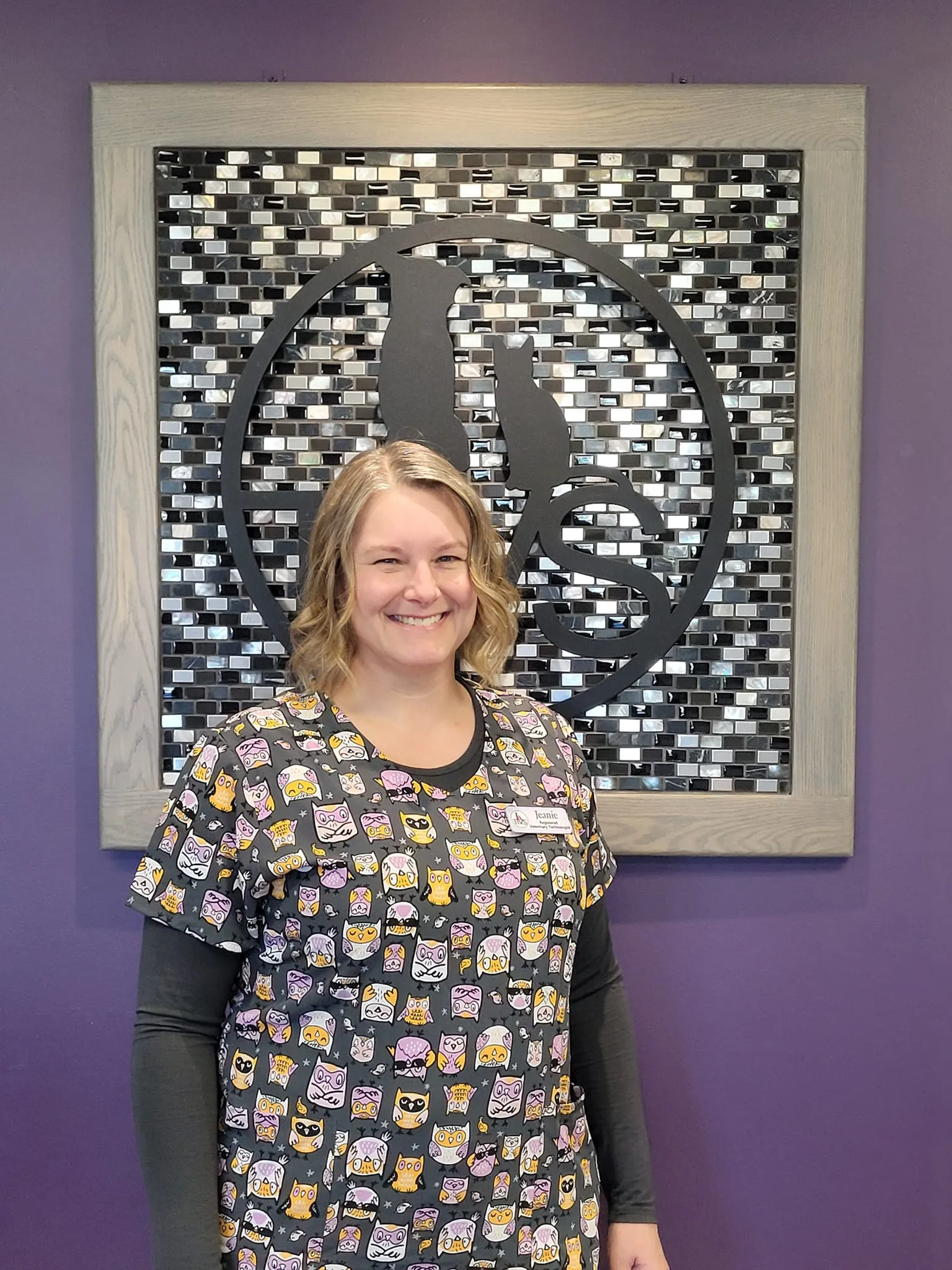 Jeanie in front of a purple wall