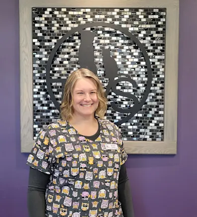 Jeanie in front of a purple wall Jeanie in front of a purple wall