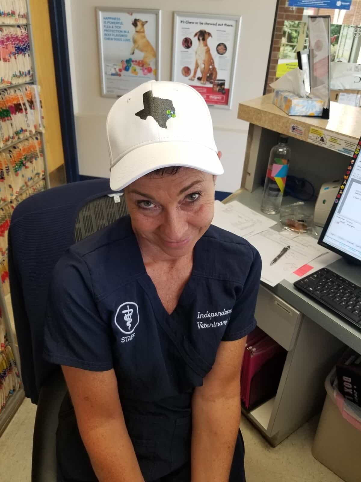Staff member sporting a Pet Well Partners hat