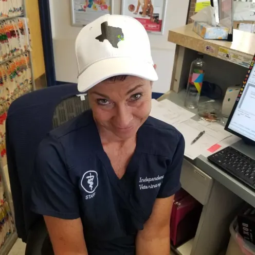 Staff member sporting a Pet Well Partners hat
