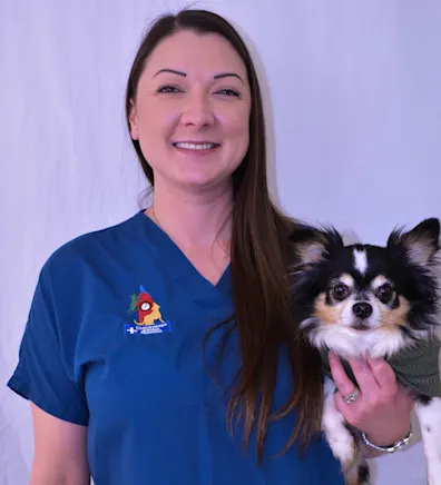 Rachel at Clocktower Animal Hospital, holding a small dog Rachel at Clocktower Animal Hospital, holding a small dog