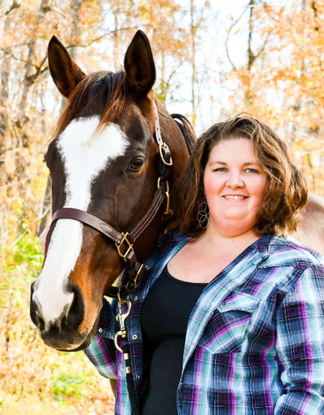 Katy Merritt with a horse and smiling at the camera Katy Merritt with a horse and smiling at the camera