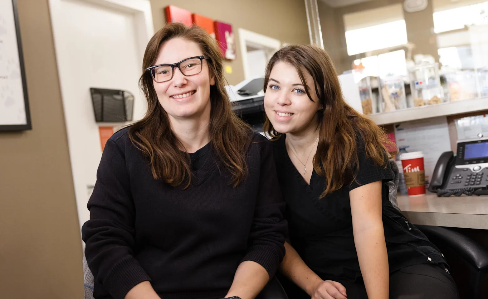 Two staff members smiling Two staff members smiling