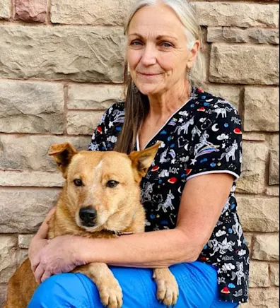 Nancy sitting with dog on her lap Nancy sitting with dog on her lap