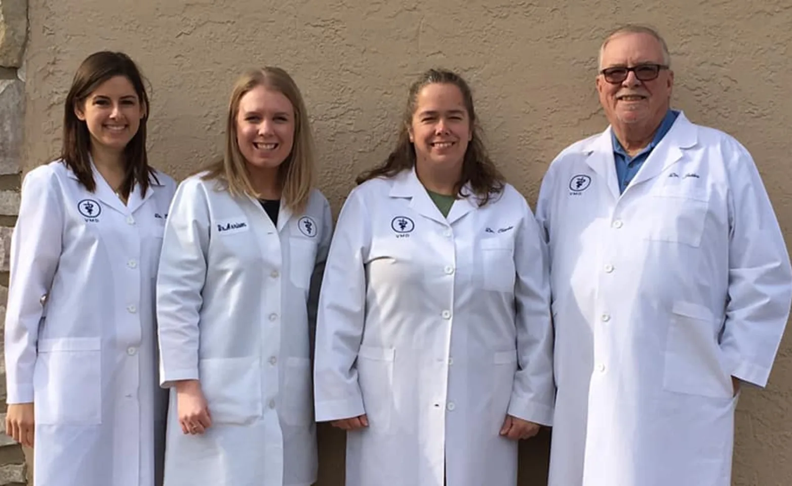 four doctors standing four doctors standing