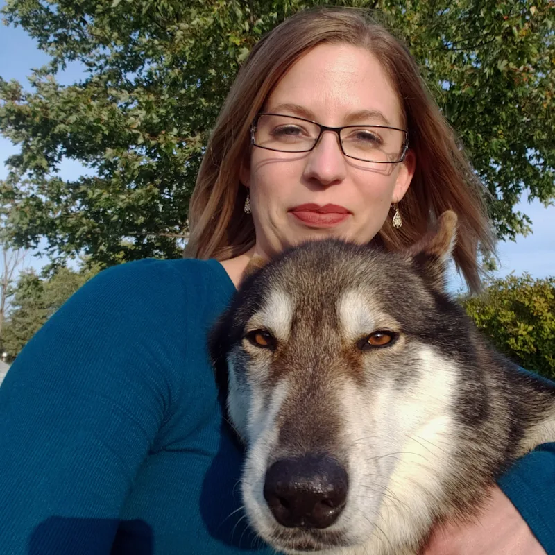 Dr. Sarah Longfield with a dog in front of her. Dr. Sarah Longfield with a dog in front of her.