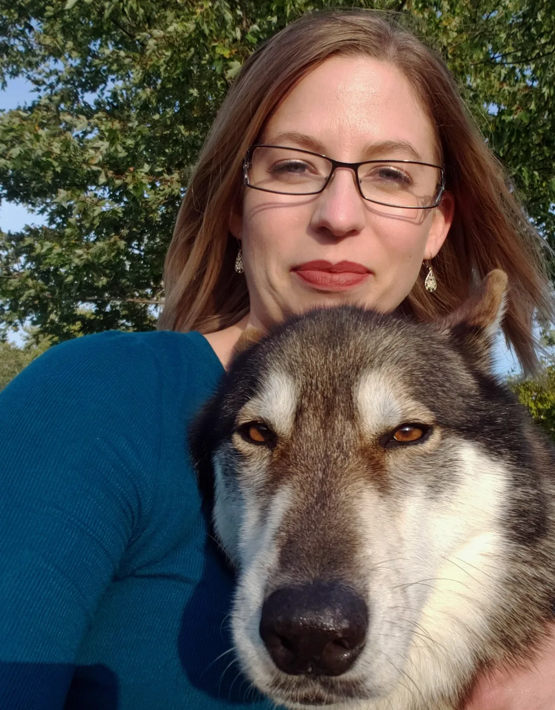 Dr. Sarah Longfield with a dog in front of her. Dr. Sarah Longfield with a dog in front of her.