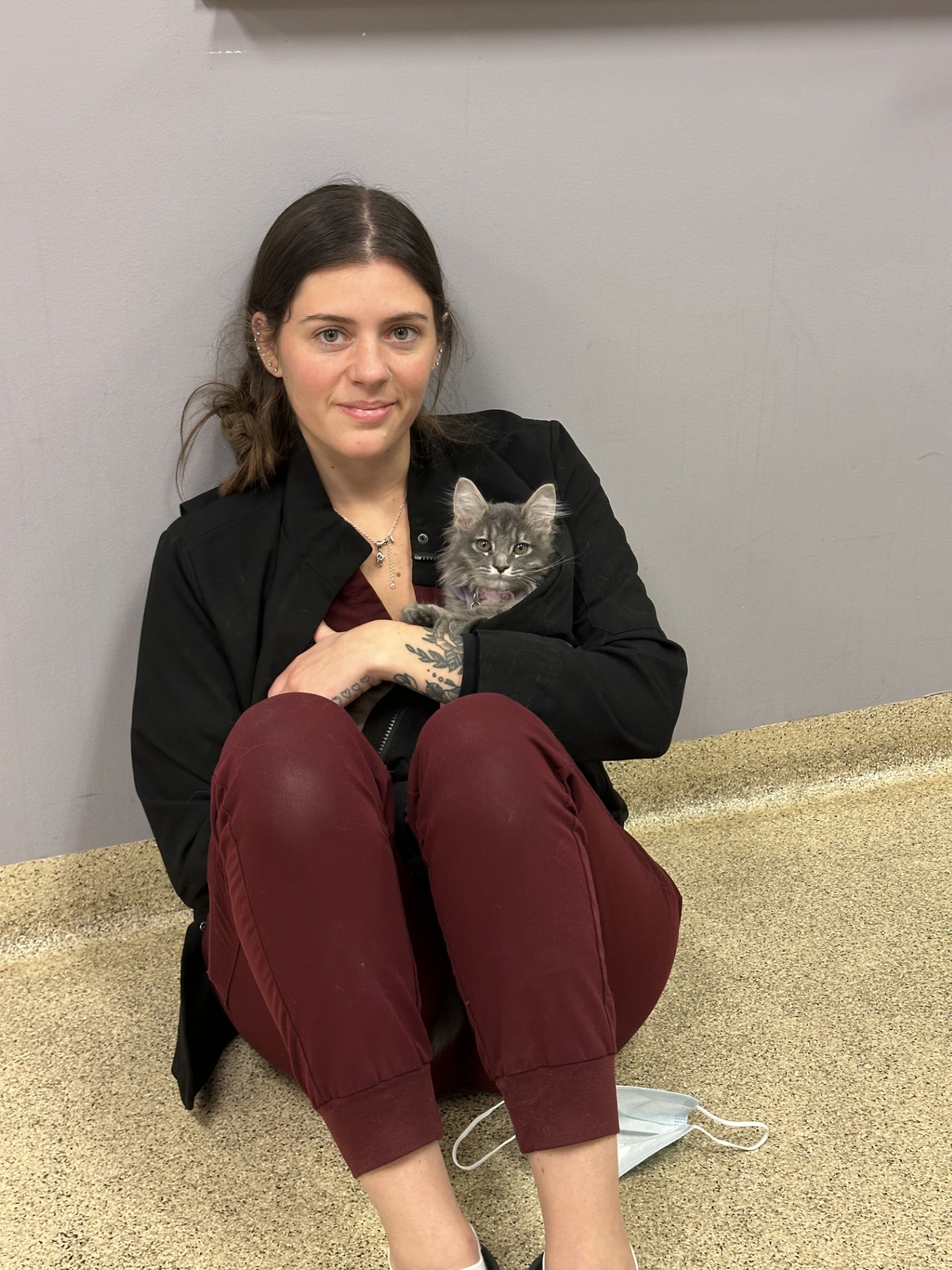 Staff member holding cat