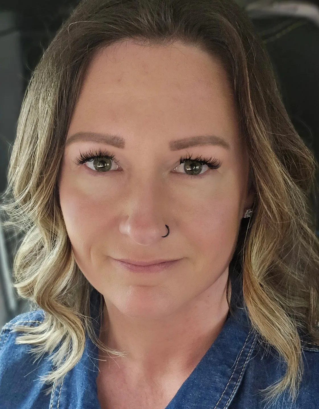 Jennifer Hawn, Hospital Manager at North Channel Animal Hospital, sitting with two dogs Jennifer Hawn, Hospital Manager at North Channel Animal Hospital, sitting with two dogs