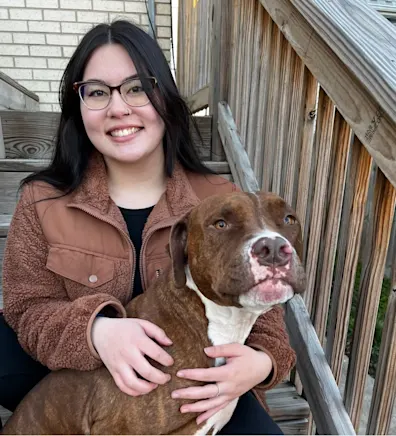 Maddie smiling with a pitbull. Maddie smiling with a pitbull.
