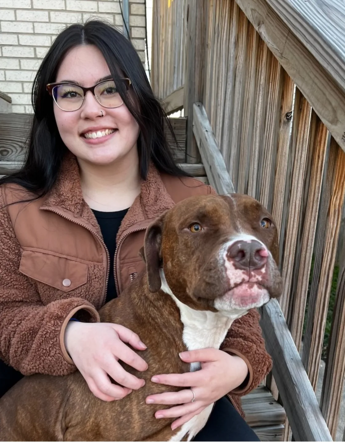 Maddie smiling with a pitbull. Maddie smiling with a pitbull.