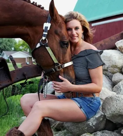 Tiffany from Midland Animal Clinic with a brown horse