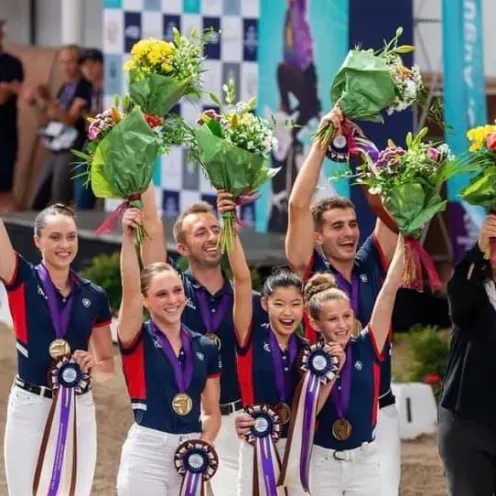 Horse Riding Champions Holding Awards & Flowers