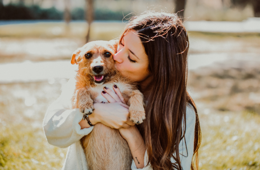 Girl Kissing Dog