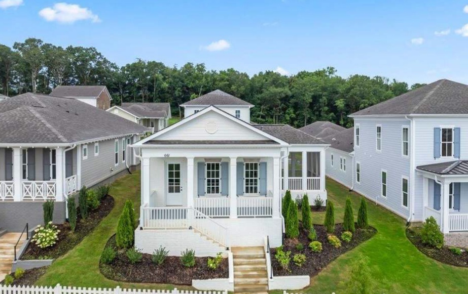Suburban houses sitting on a hill.