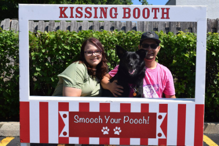Staff Members Working at a Dog Kissing Booth