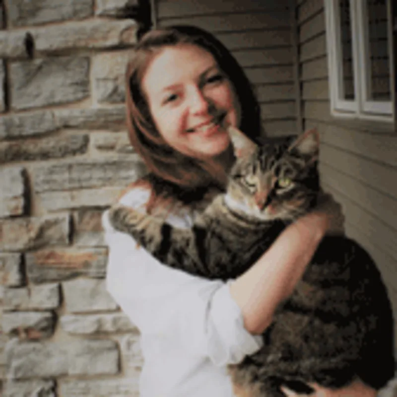 Dr. Laura Reynolds holding a cat Dr. Laura Reynolds holding a cat