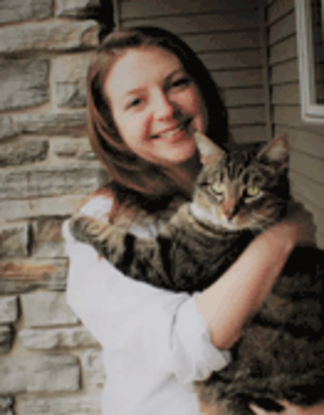 Dr. Laura Reynolds holding a cat Dr. Laura Reynolds holding a cat