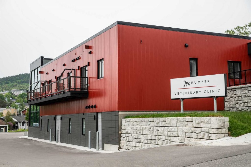 Hospital Exterior With Hospital Logo Sign