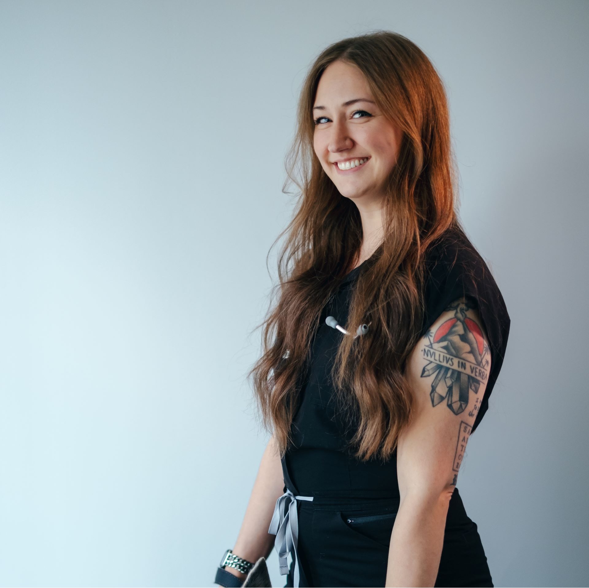 A veterinarian posing with a cat