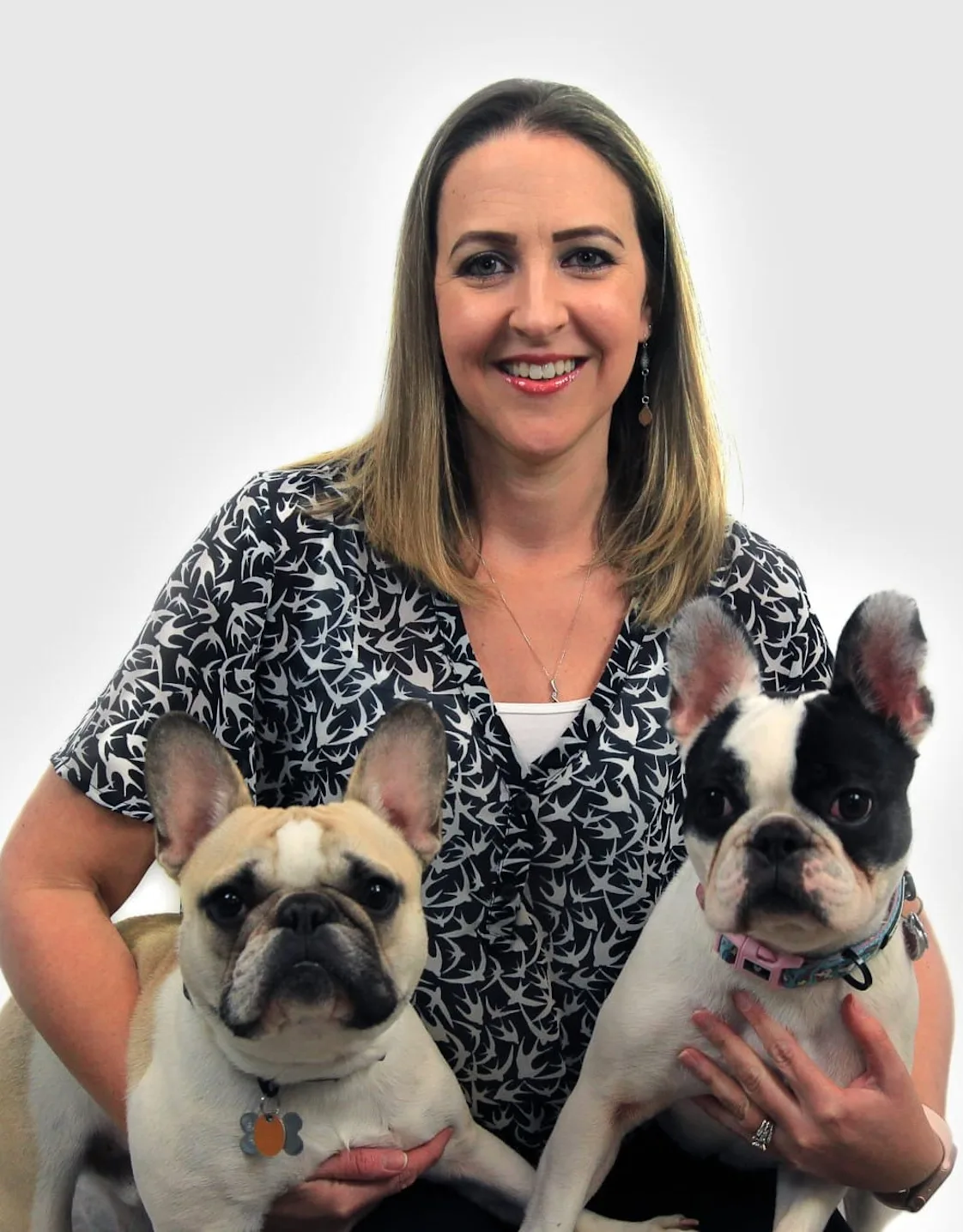 Vicky Brister holding 2 dogs Vicky Brister holding 2 dogs