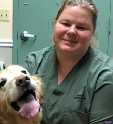 Dr. Valerie Latchford with a happy dog Dr. Valerie Latchford with a happy dog