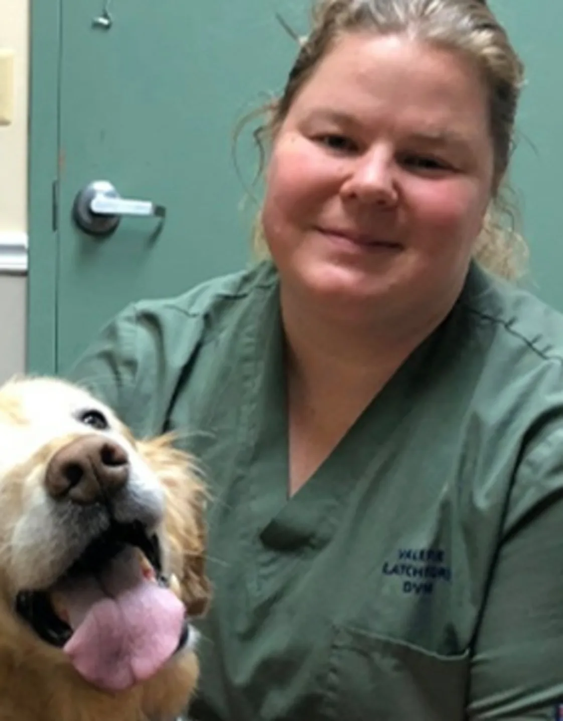 Dr. Valerie Latchford with a happy dog Dr. Valerie Latchford with a happy dog