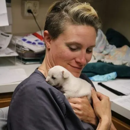 Dr. Olson holding a puppy