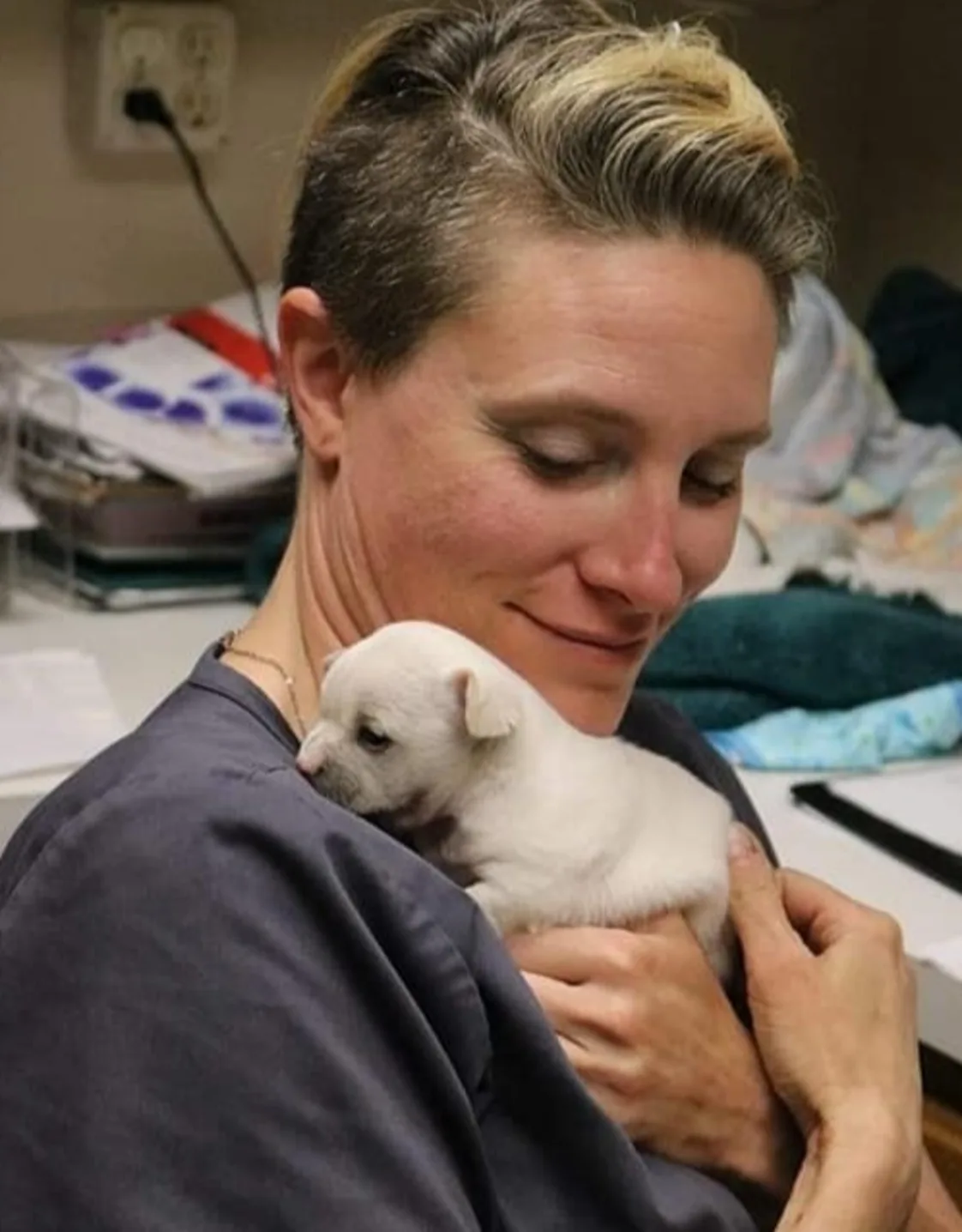 Dr. Olson holding a puppy Dr. Olson holding a puppy