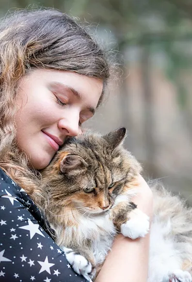 woman hugging cat woman hugging cat