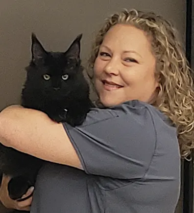 Patty McCullough holding a black cat Patty McCullough holding a black cat