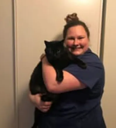 Caroline holding black cat