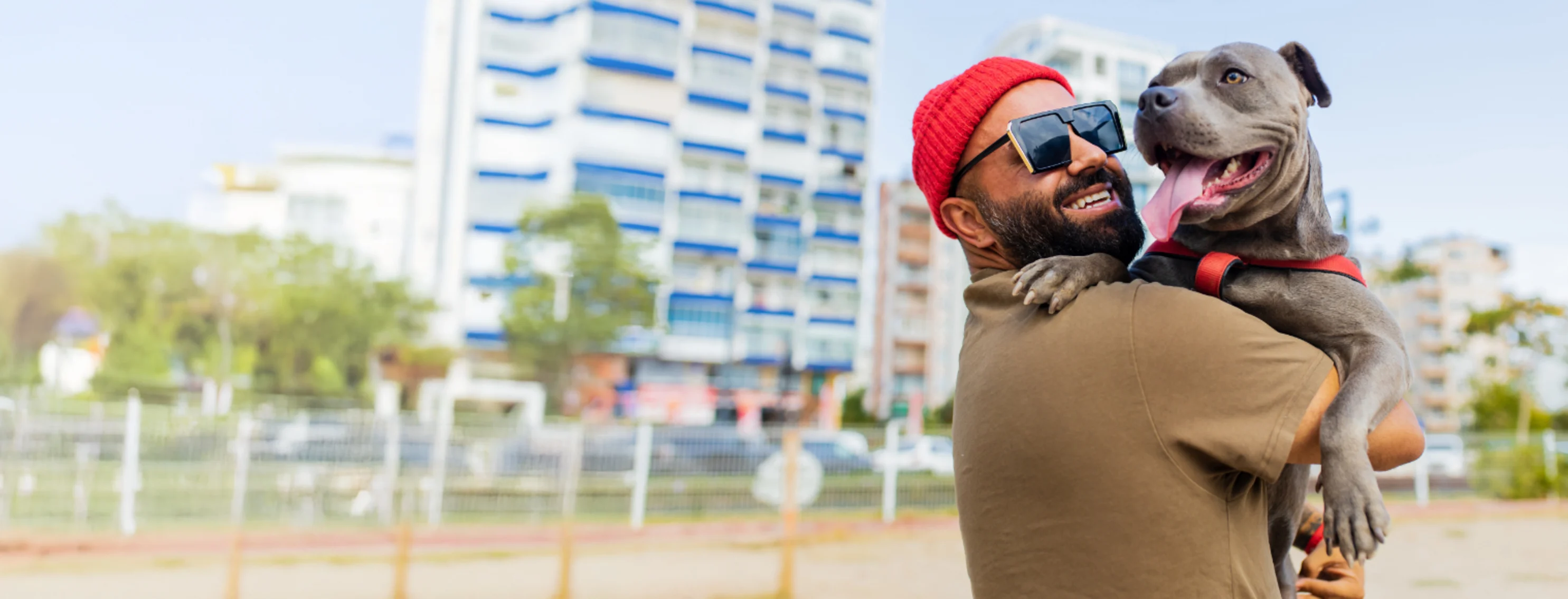 Man Wearing Sunglasses Hugging Dog Man Wearing Sunglasses Hugging Dog