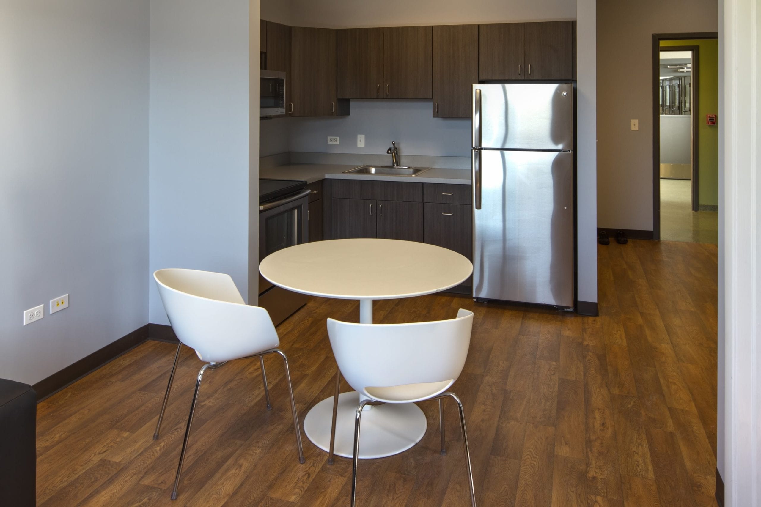 room with table and kitchenette area